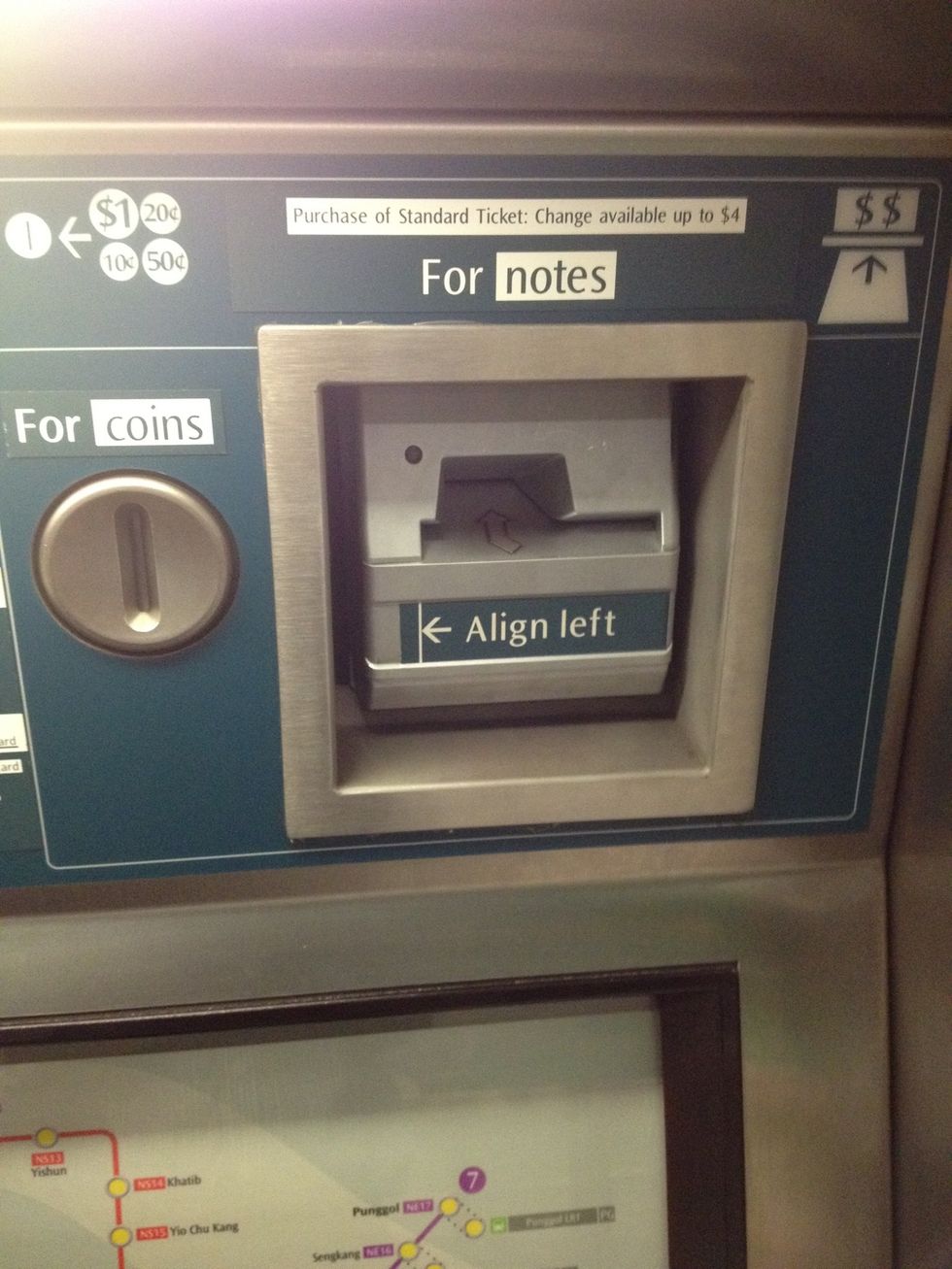 Put the money in the correct slot for notes and coins on the upper right of the machine. For notes, carefully align the notes to the left. You can only put one note or coin at a time
