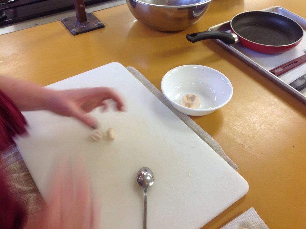 Put the mushroom tops off to the side and all the stems on a cutting board.