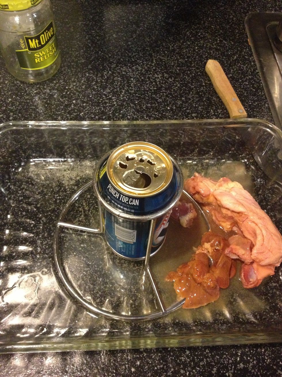 Put the neck and liver (optional) in the bottom of pan to flavor the drippings. Add water to make a shallow bath. Pour or drink \ud83d\ude09 a half of the beer and put into stand and poke large holes on top.
