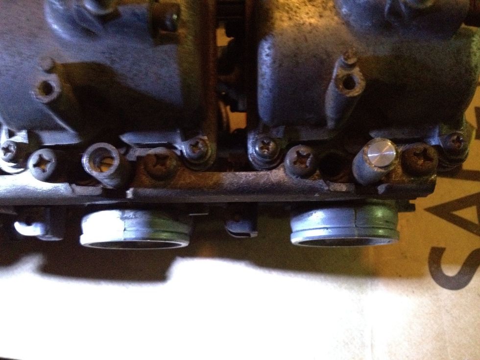 Put the new plug on and add some thread lock glue to it. Clean the whole thing up with carb cleaner and reinstall.