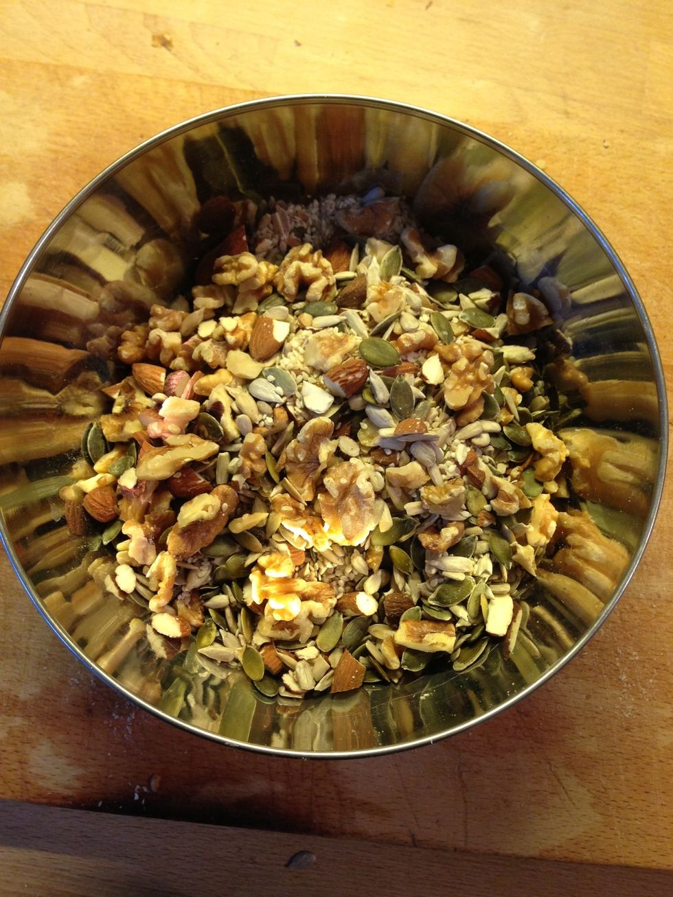 Put the nuts, seeds and salt in a bowl.