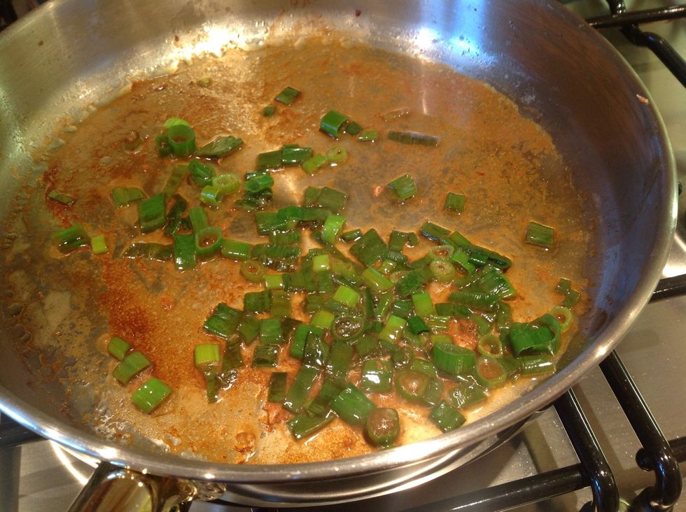 Put the onions in the pan with a little olive oil if the pan is dry. Add the wine after 2 minutes and simmer on low for several minutes until the liquid reduces by half.