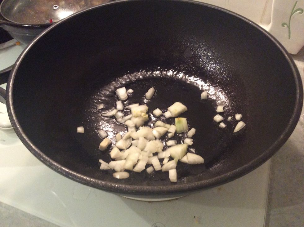 Put the onions you minced earlier into the pan and stir until about golden brown