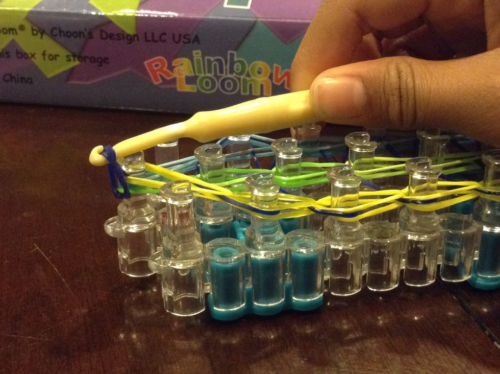 Put the other half of the rubber band on the hook