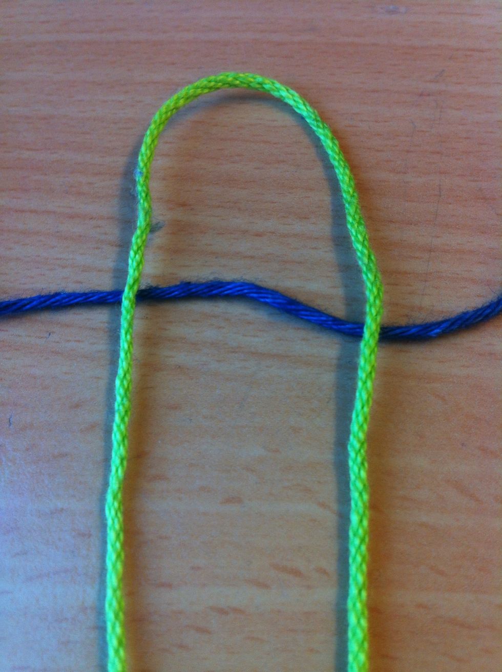 Put the other yarnpiece under the first