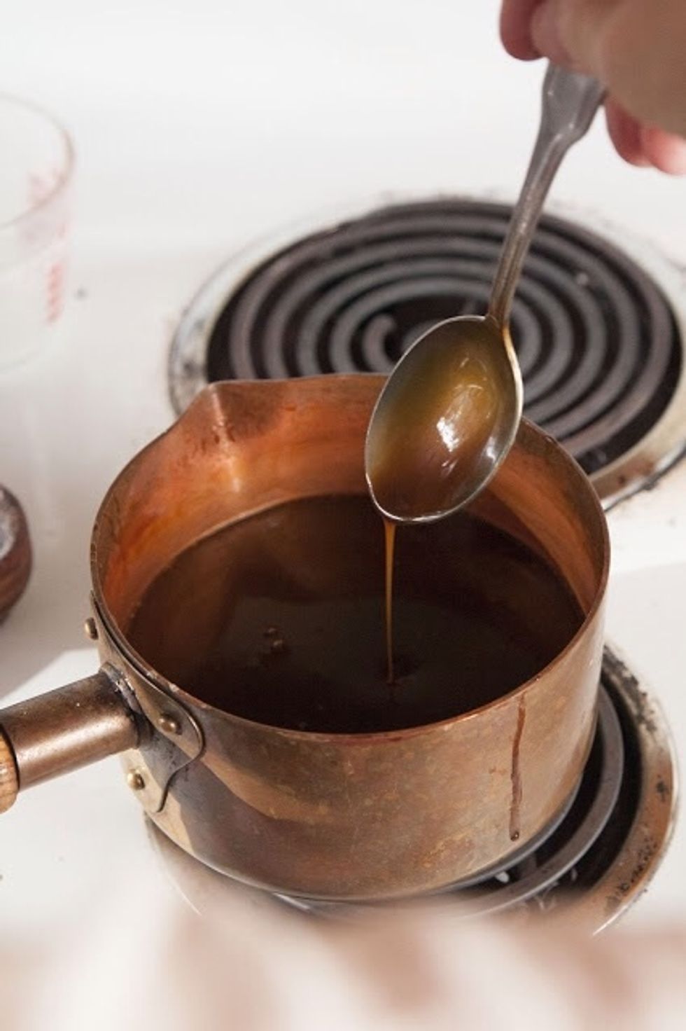 Put the pan back on the stove. Turn down the heat to medium and cook for another few minutes until the caramel turns thick and creamy. Look for it to coat the back of a spoon.