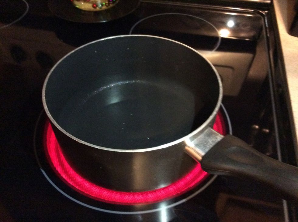 Put the pan of water on the stove.