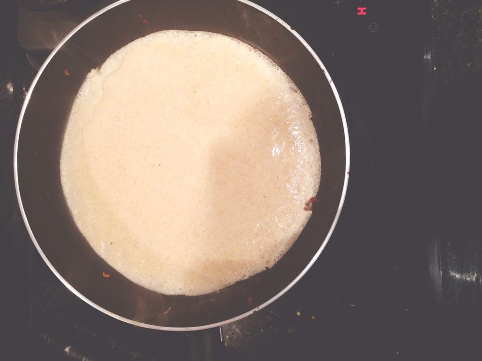 Put the pan on high-medium heat. Pour the mixture in the pan and stir around until it's covered. Take the pan away from the heat and flip pancake when edges curl up. Heat until golden on both sides.