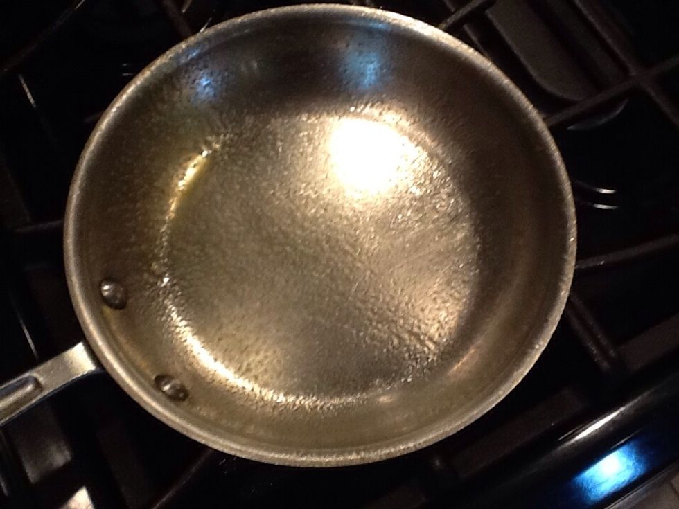 Put the pan on the oven and spray the Pam on it.