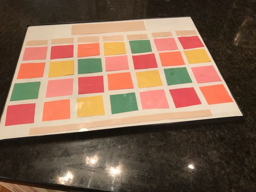 Put the paper back into the frame.