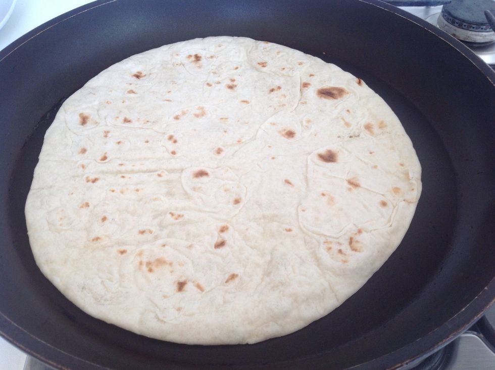 Put the piadina in the hot frying pan,