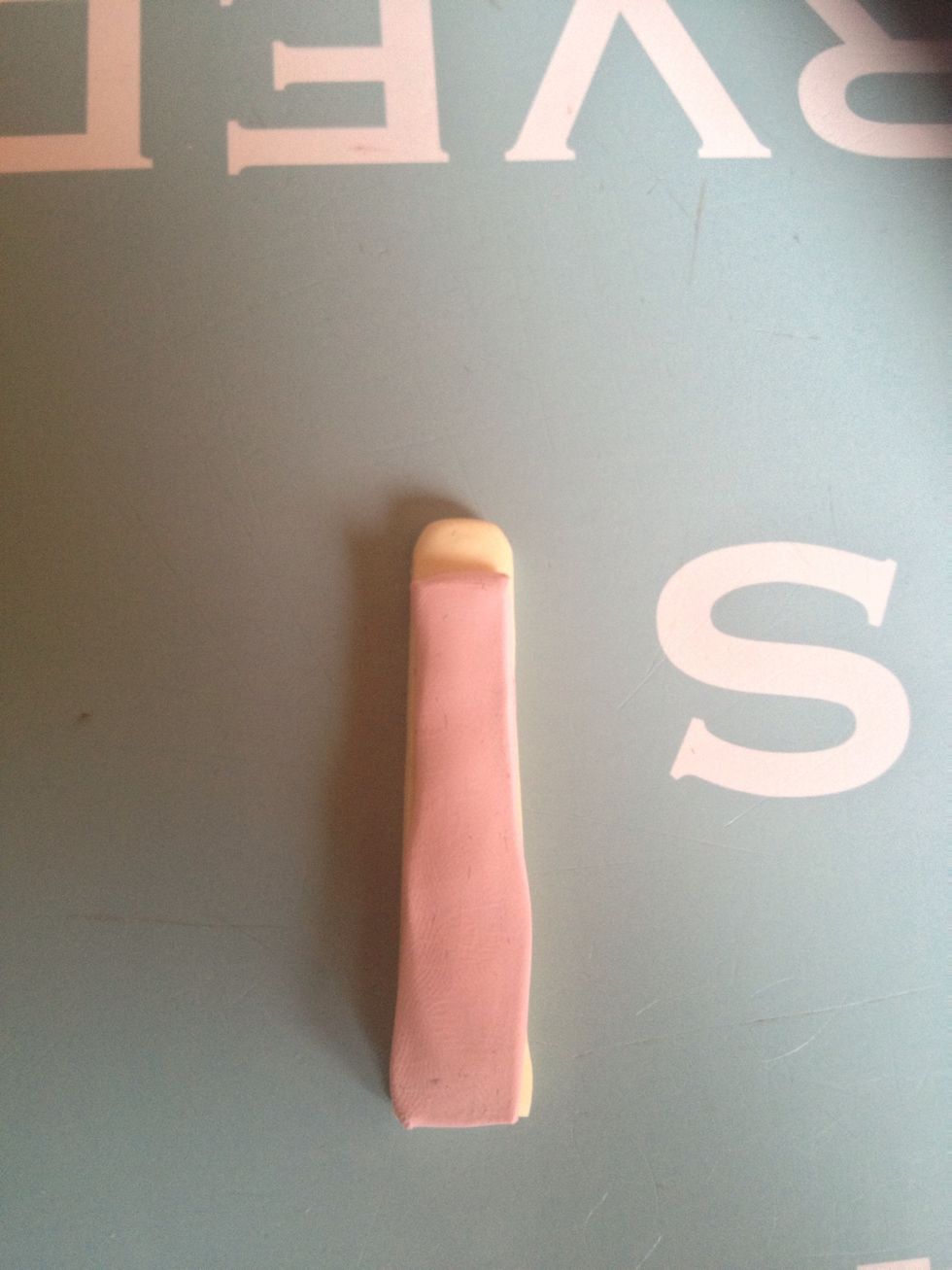 Put the pink on top of the yellow and make sure there is space at the top. As shown.