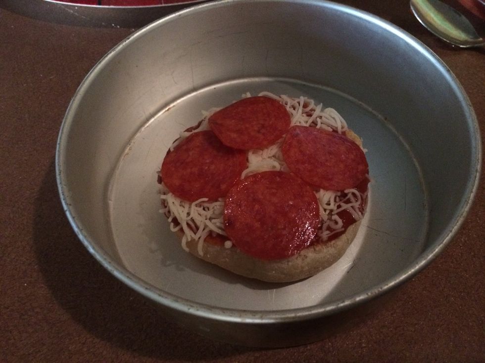 put the pizza in a baking pan , and pre-heat your oven at 350, and bake for about 4 minutes or until cheese is melted\u27a1\ufe0f