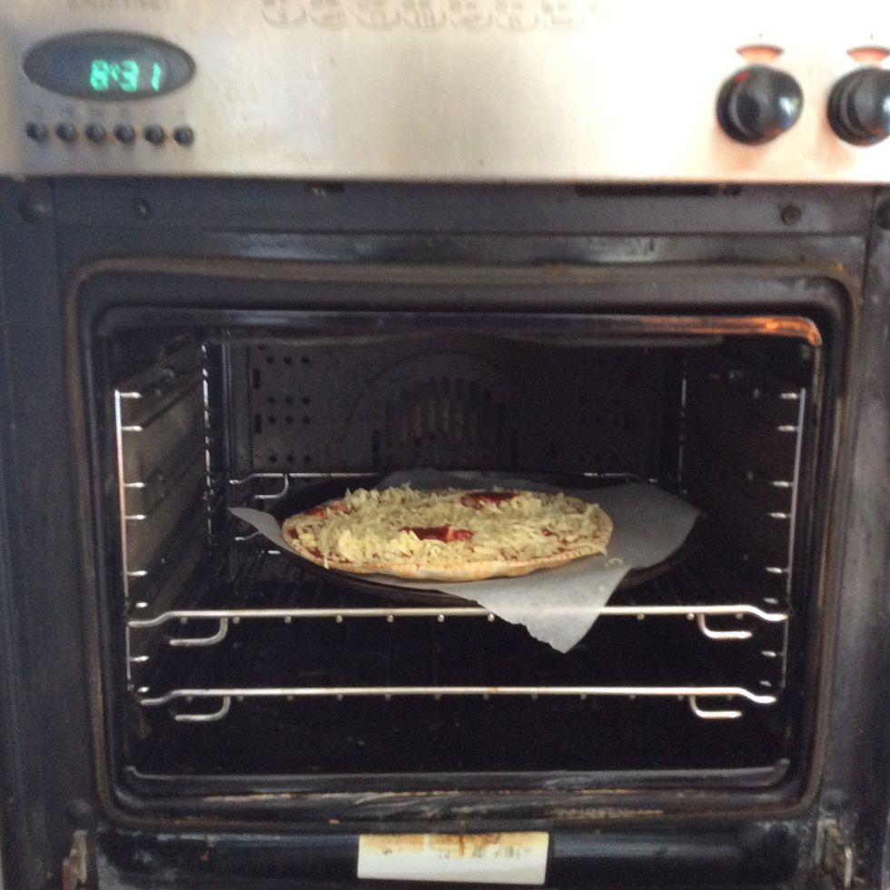 Put the pizza in the oven for 10 minutes or until the cheese melts