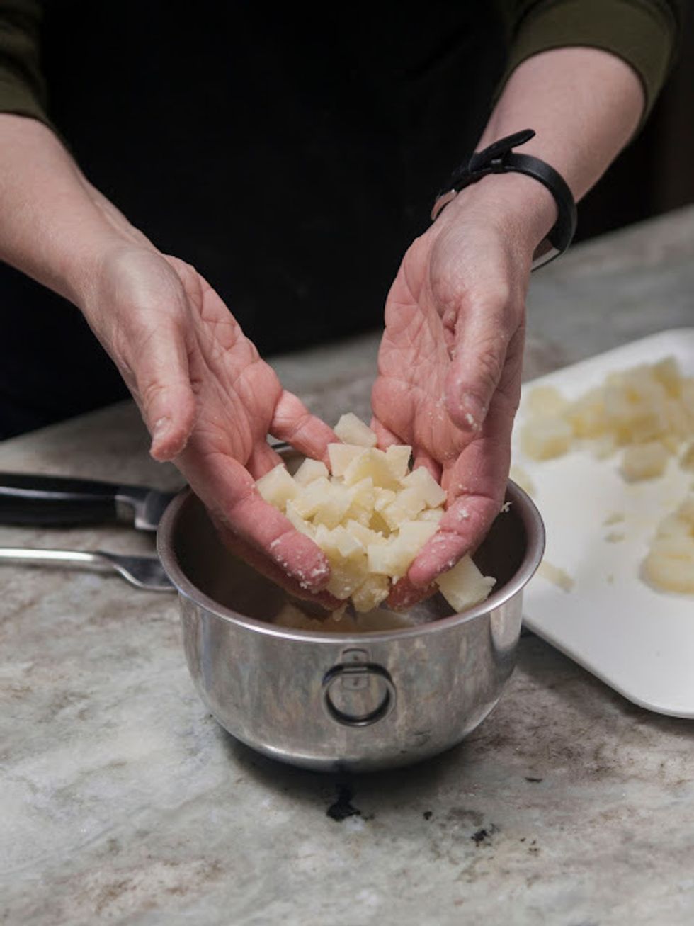 Put the potato in a small pot of water to cover and bring it to a boil. Boil until tender, about 10 minutes or so. Let the potato cool, then peel & chop into cubes (this can be done in advance.)