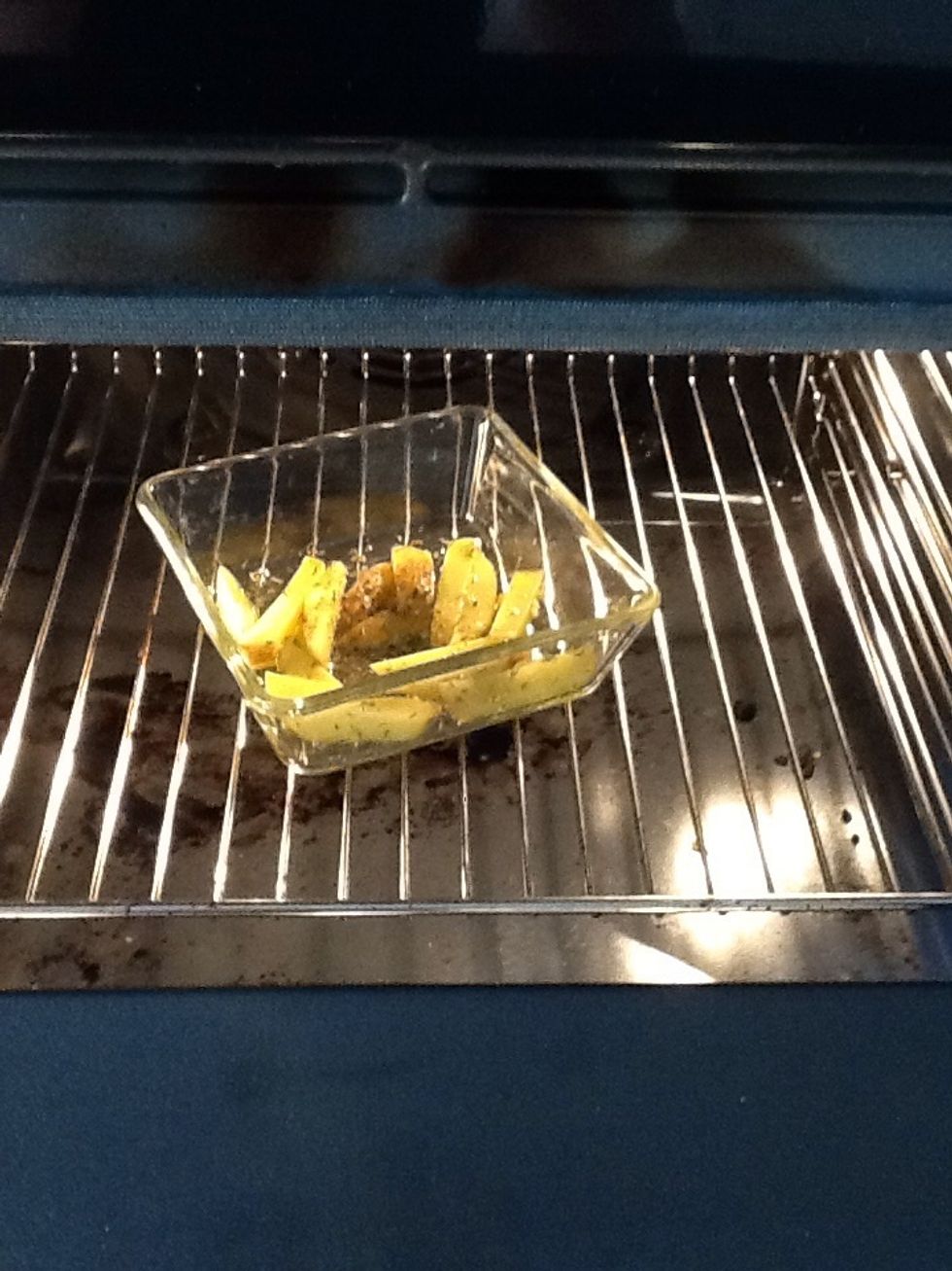 Put the potatoes into the owen, set the timer for 10 min. After 10 min. Stir them around with a spoon and bake them for about 10 more min.