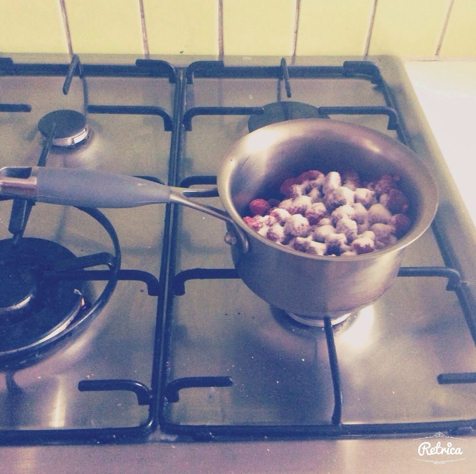 Put the raspberries and 1/2 of the caster sugar into a medium sized saucepan. Bring to a boil then let it cook for 2 minutes, while mashing the raspberries.