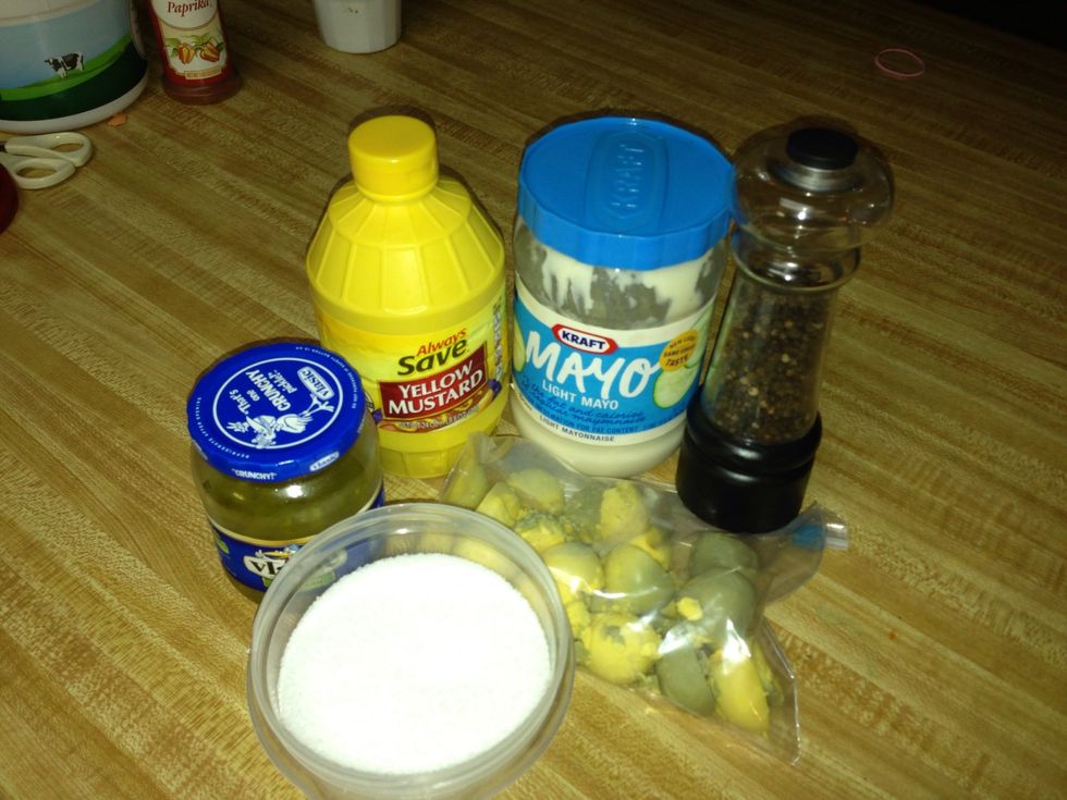 Put the relish, mayo, mustard, salt and pepper in with the yolks and squish, squish, squish until its smooth.