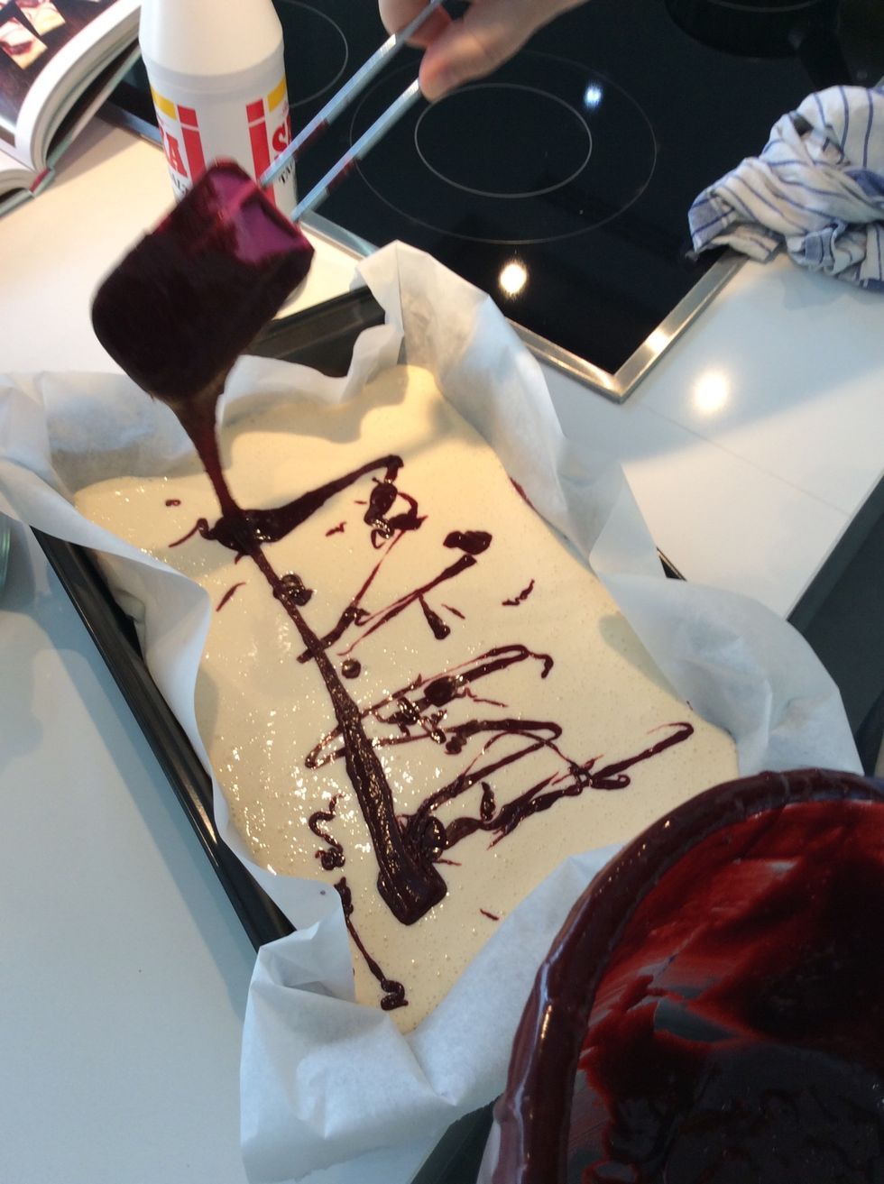 Put the remaining red velvet in drops on top creating uneven draws