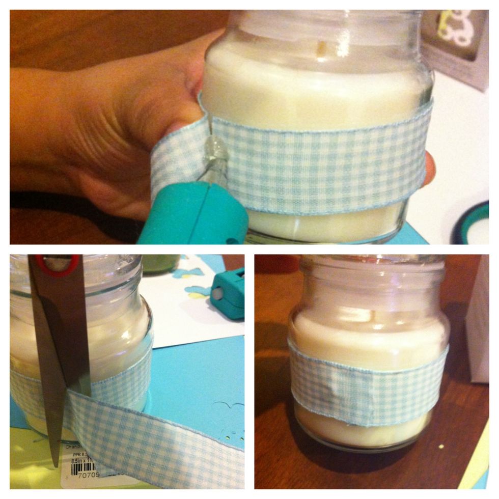 Put the ribbon around the candle,glue it & cut it.