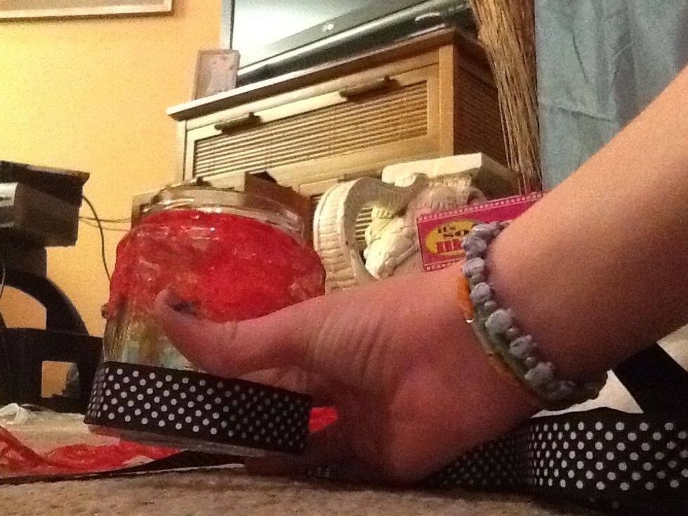 Put the ribbon on the bottom of the jar.