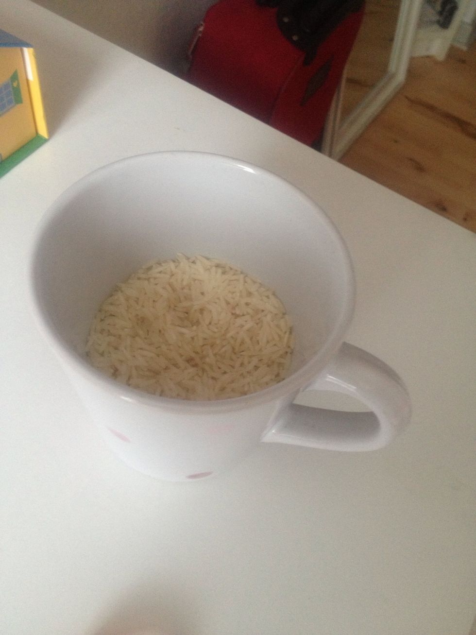 Put the Rice ind the cup.