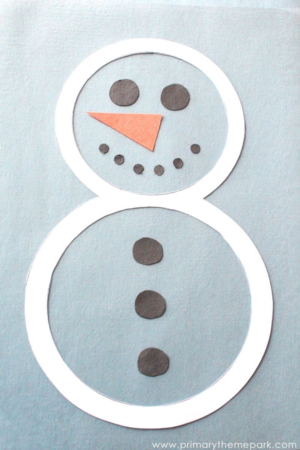 Put the rock for the mouth and for the button and for the eye.