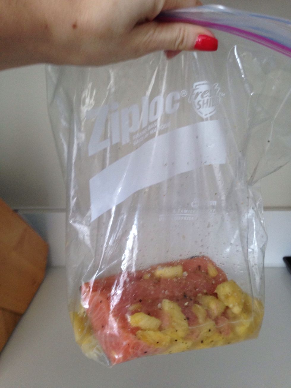 Put the salmon, the seasoning (i used Dash) the pinapple and a lil bit of water, you can add soy sauce instead and also ginger to make it more yummy) 2 or more hours on the fridge or overnight!