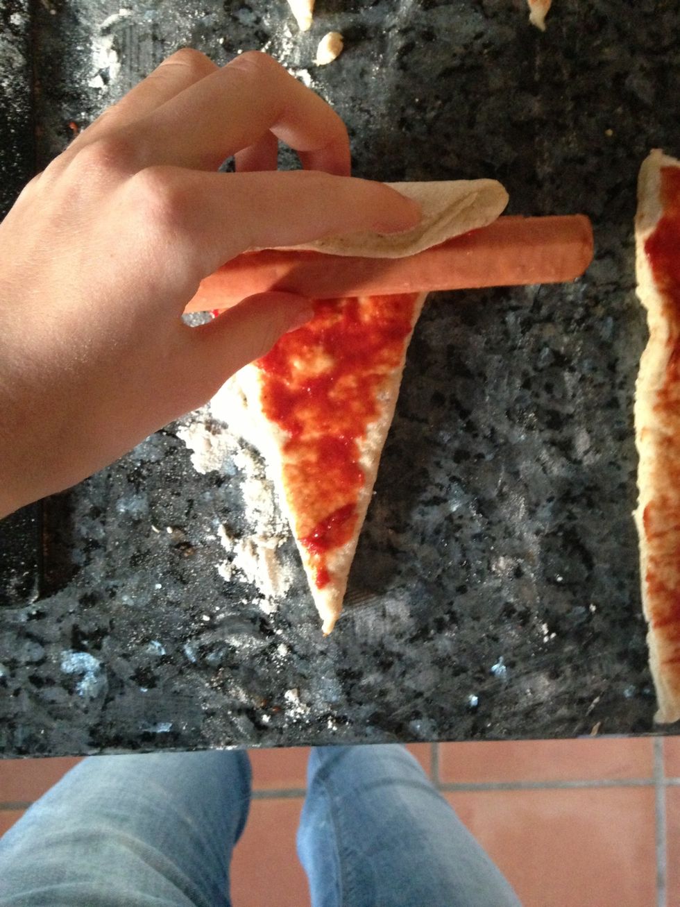 Put the sausage on and roll the dough around