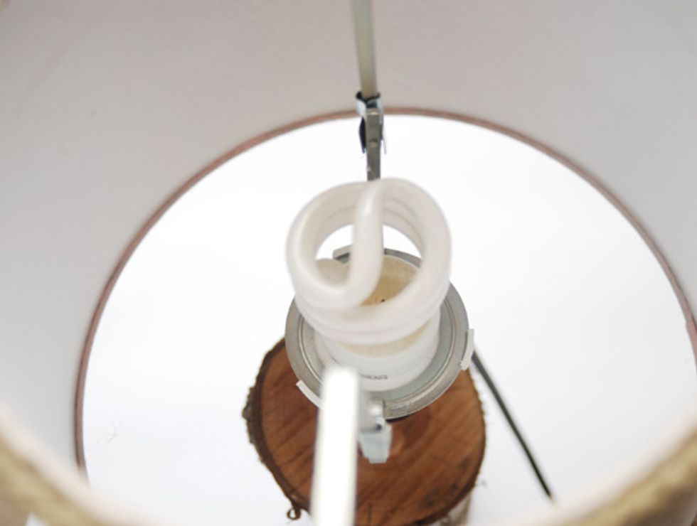 Put the shade on the fixture and screw into shot.