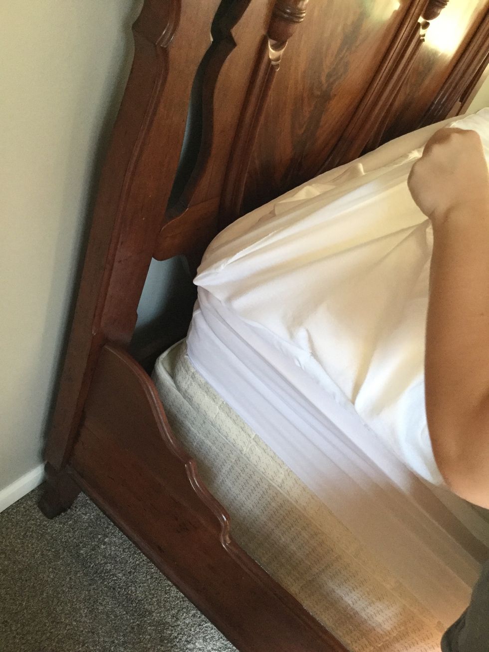 Put the sheet with your hand in it at the corner of you bed