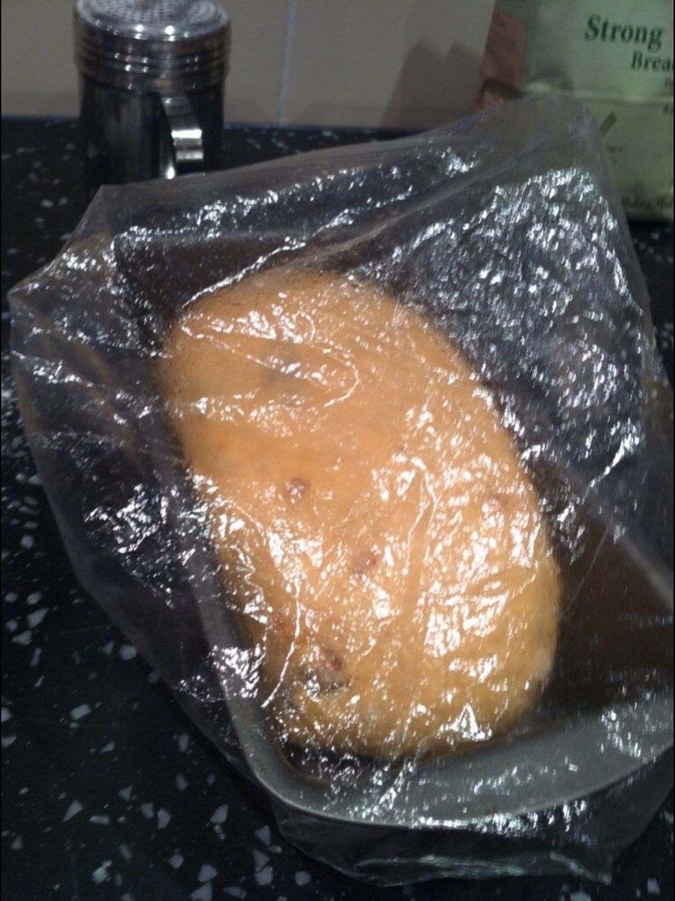 Put the shower cap over the tin and dough ensuring there us enough room for the dough to rise