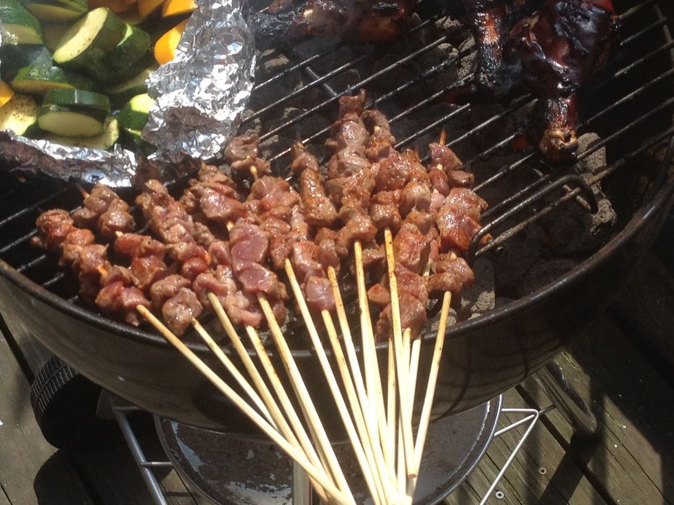 Put the skewers on the grill. Sprinkle salt, black pepper, paprika, cumin. Flip the skewers every 30 seconds.