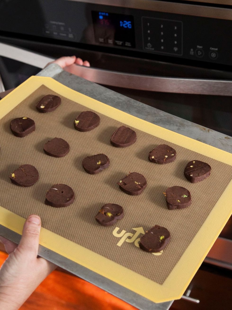 Put the sliced cookie dough on the baking sheet giving them enough room between, (about 1 inch) and pop them into the oven.