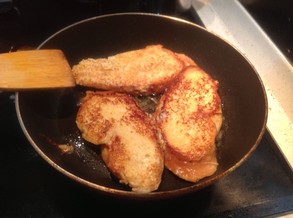 Put the soaked bread, fry on each side for about 2 minutes until golden brown