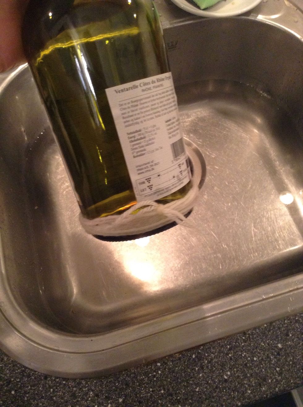 Put the soaked cotton string back on the bottle