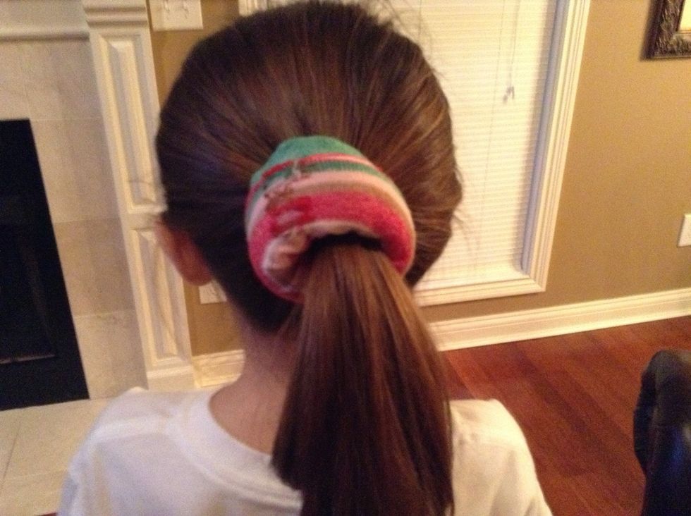 Put the sock on your ponytail like this.
