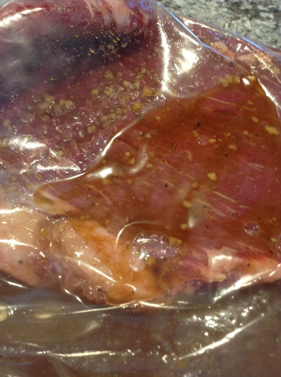 Put the steak in a bag. Then pour in the marinade. Seal it up wicked tight