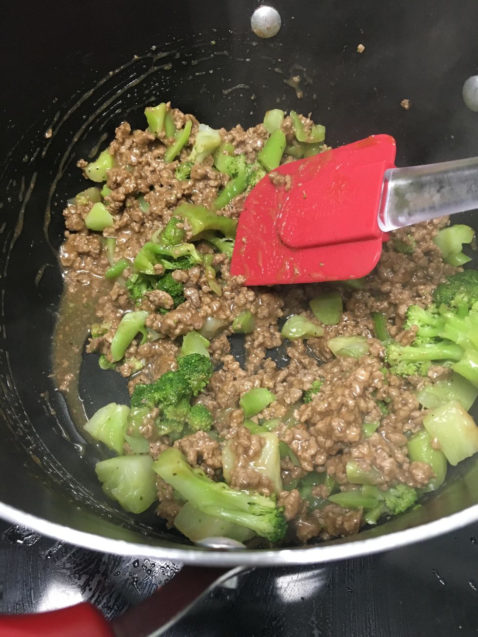 Put the steamed broccoli into the mixture.