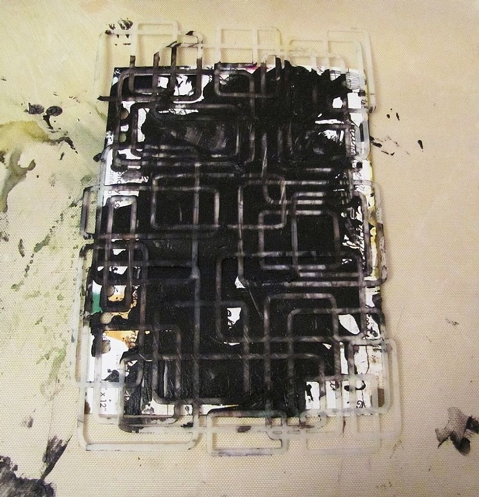 Put the stencil on the page and apply Black Leather Jacket through the stencil. Using spatula.