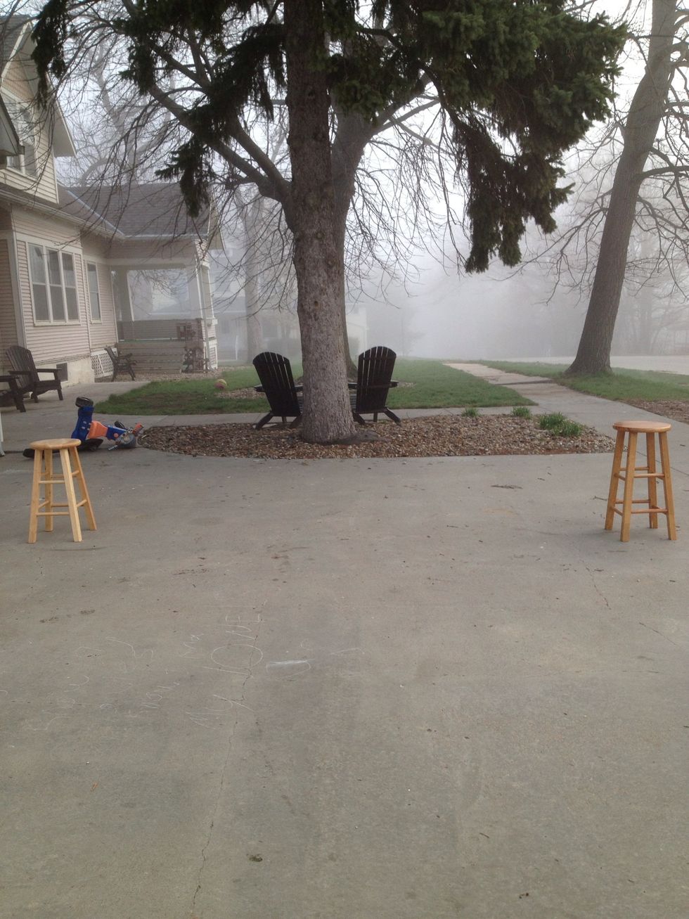 Put the stools an even amount away on each side of the hoop.