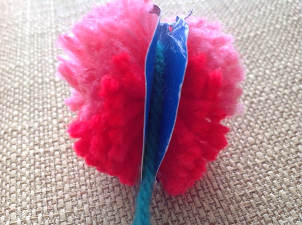 Put the string in between the 2 circles.