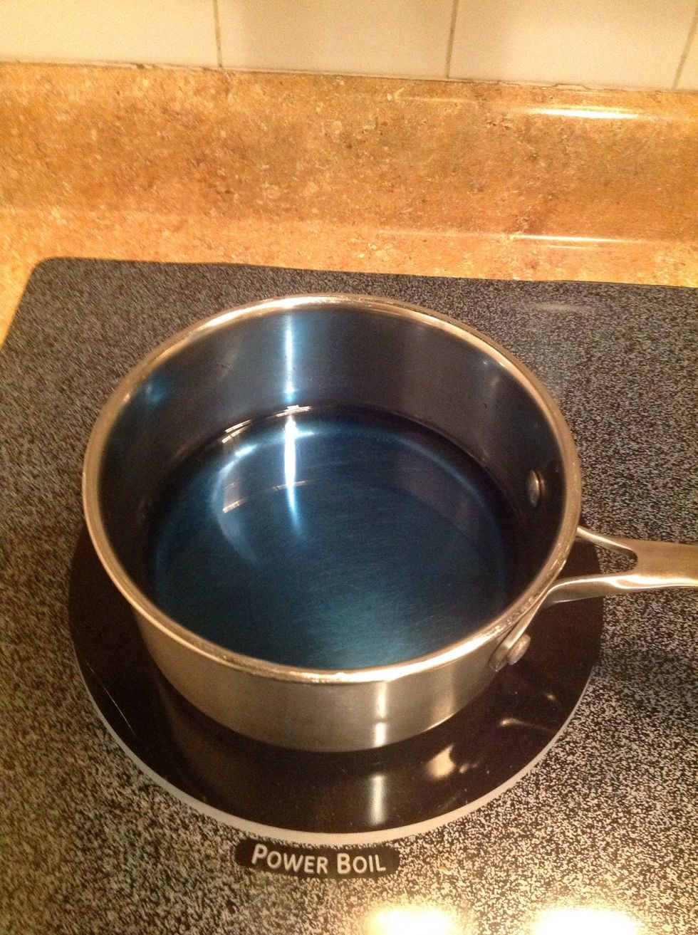 Put the sugar and the water in a pot on medium-high heat and make a simple syrup my dissolving the sugar in the water. Pull the syrup from the heat and add 3-4 drops of food coloring and mix. Let cool