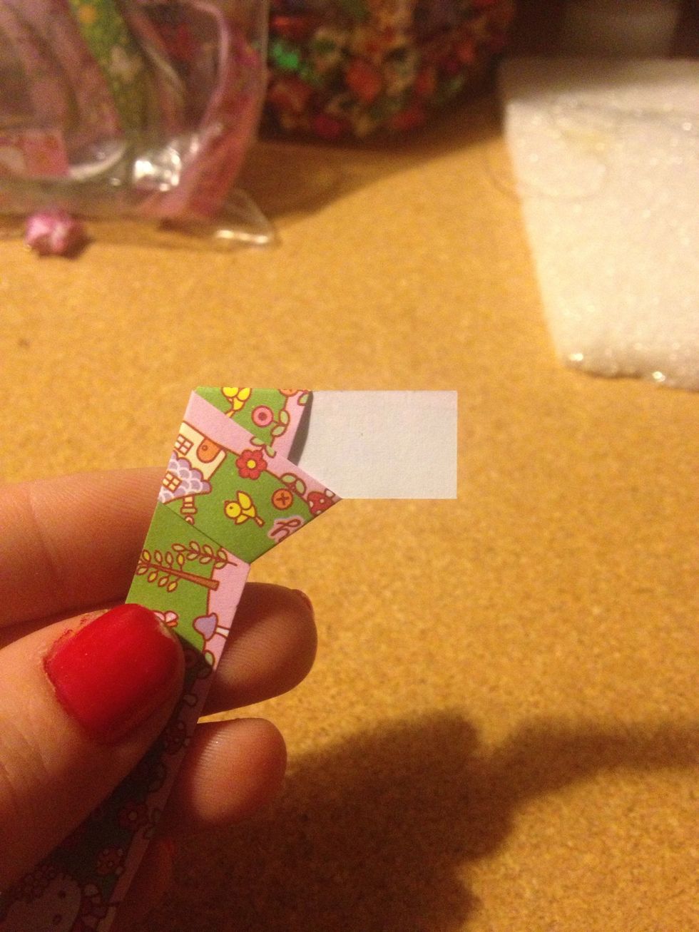 Put the tail through the loop and make a knot.