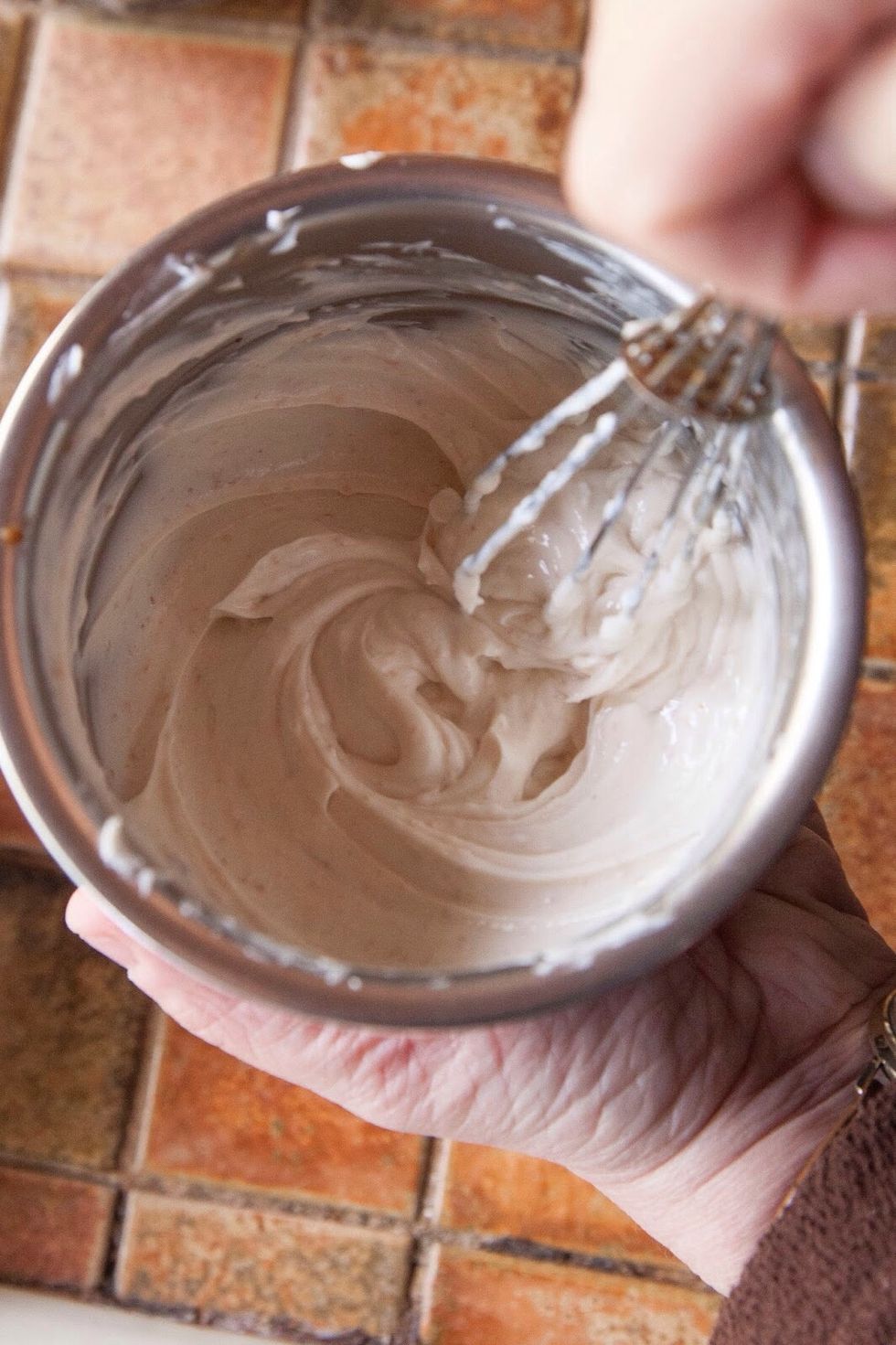 Put the tamarind paste into a bowl. Add in the salt, the brown sugar and the yogurt.