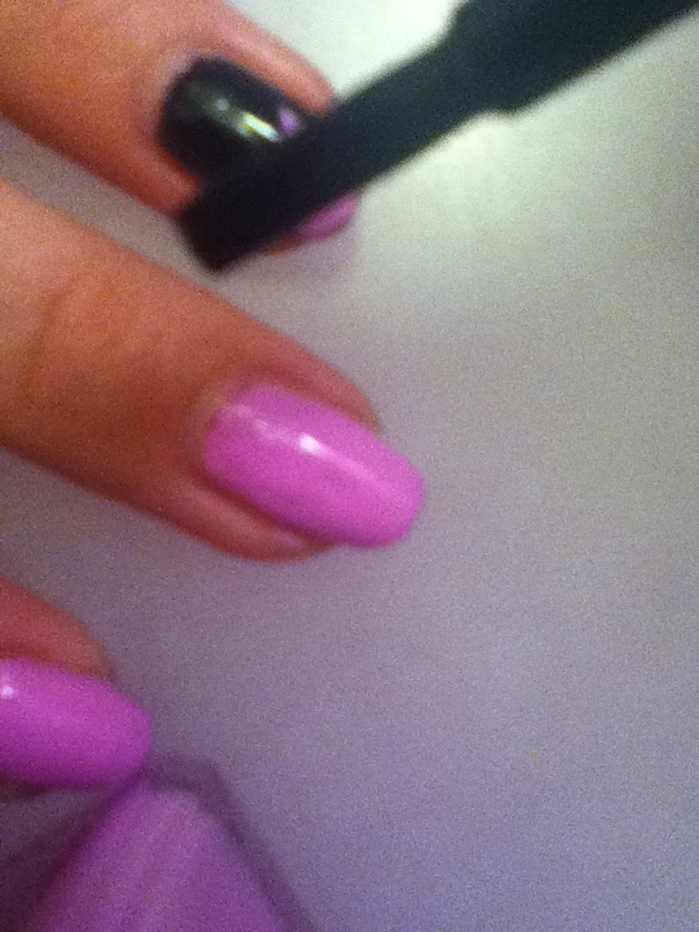 Put the tape down on your nail and paint the black over it.