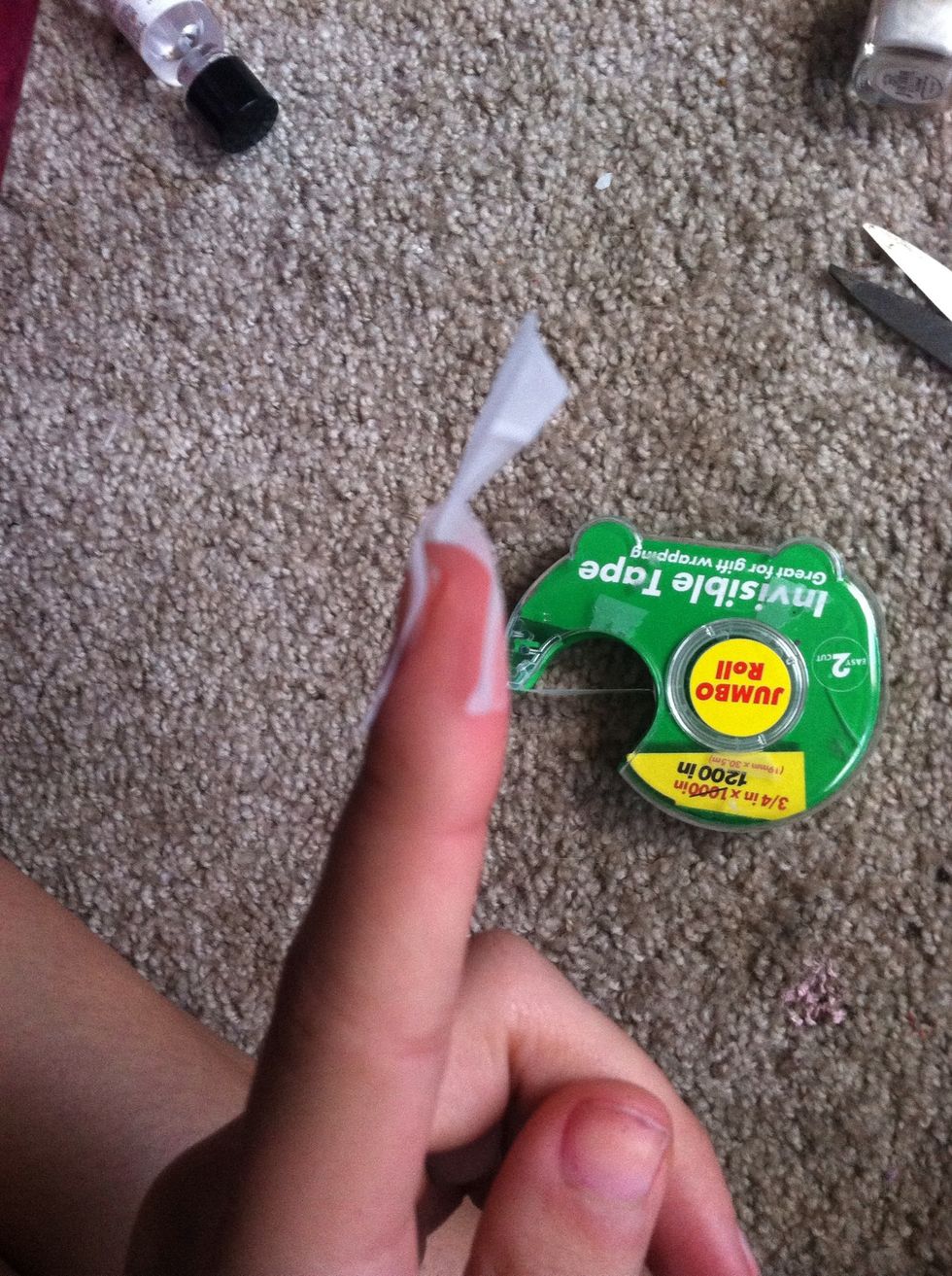 Put the tape on your finger or wherever like this...