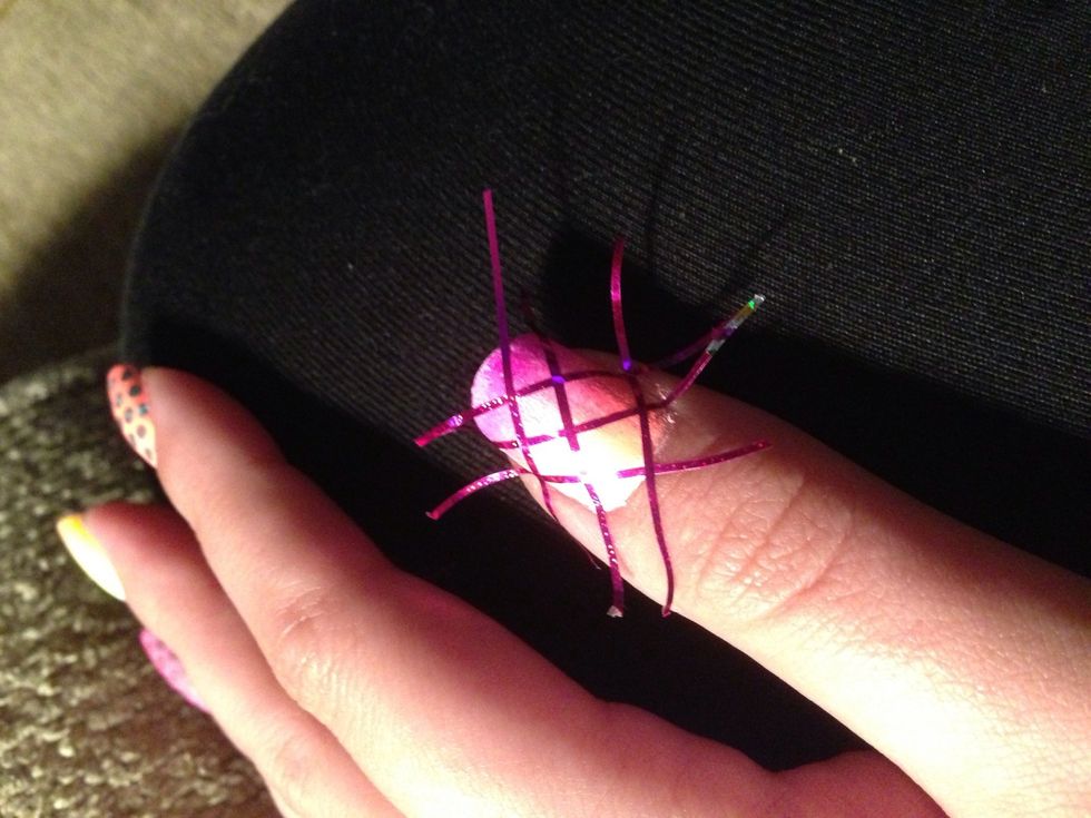 Put the tape on your nail, making sure that it's completely flat.