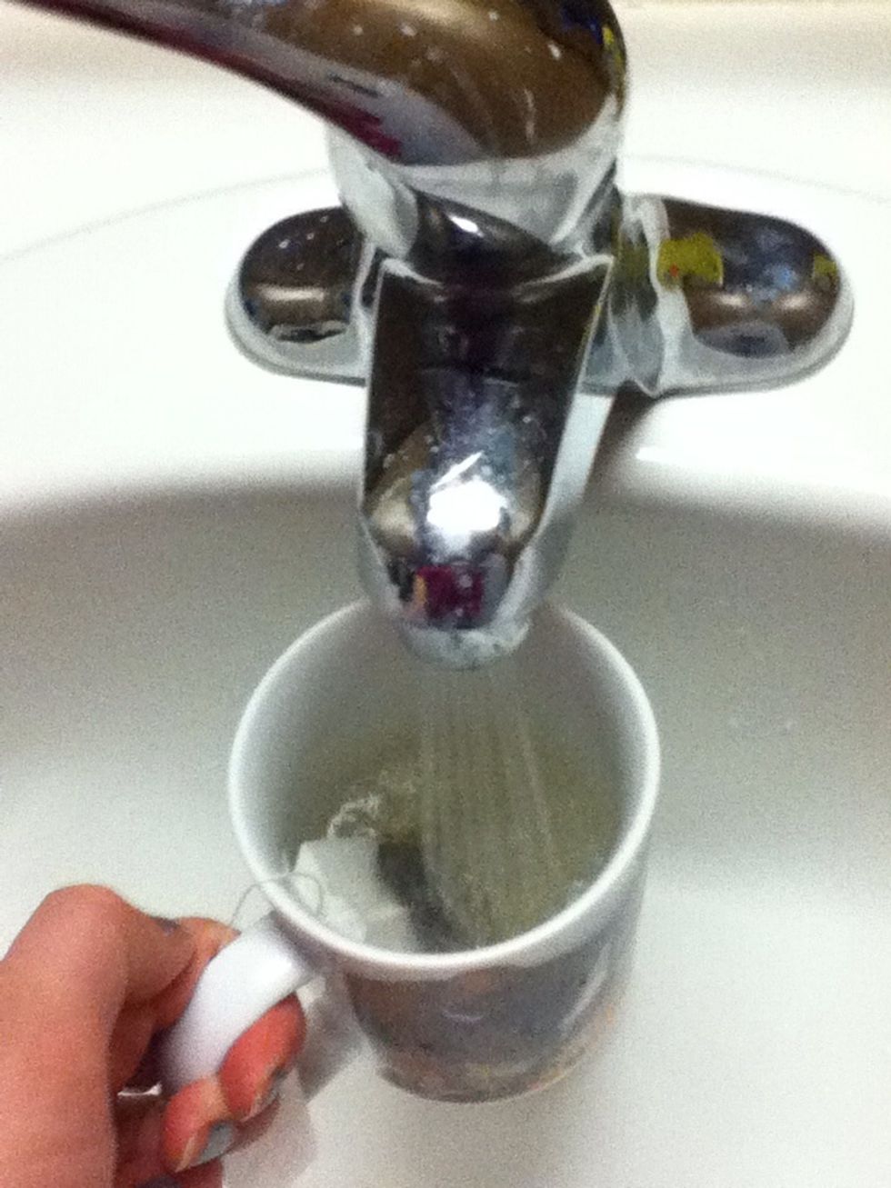 Put the tea bag in the mug and fill it with semi-hot tap water. This way it does't have to steep as long.