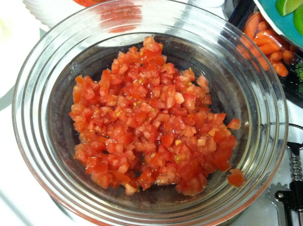 Put the tomato a mixing bowl.